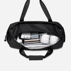 حقيبة رياضية فاخرة مقاومة للماء بسعة 25 لترًا مع حجرة للأحذية وأشرطة قابلة للفصل للرجال والنساء - Arctic Hunter LX00537 / Premium 25L Water-Resistant Gym Bag with Shoe Compartment and Detachable Straps for Men and Women - Arctic Hunter LX00537 - Sooqja سوقجة